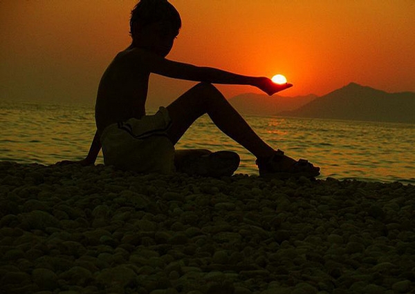 Boy Holding Sun picture