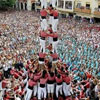 an attempt at forming a human pyramid in the middle of the square