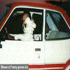 White puppy driving a car funny dog photos