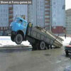 Truck with front wheels in the air overloaded with wooden logs comical