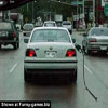 Car driver forgot to take the nozzle out when leaving the gas station