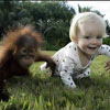 cute girl is racing a monkey in this sweet picture