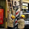 short ladder? No problem for chinese workers