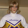 some guy poses in the cheerleader uniform