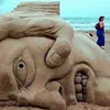 funny statue made from sand