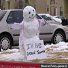 Goofy pics snowmen with a funny sign