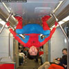 Goofy photos spiderman travelling by tube