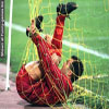 Funny soccer pictures goalie tangled in net