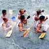 group of rowers is sinking