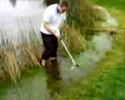 some dude tries to hit the ball in water