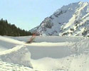 skier jumps into the huge pile of snow