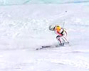 a skier hits the gate with his balls