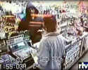 video of robber hitting shop assistant to the face.