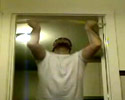 heavy guy doing pull-ups