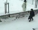 snowman throws a snow balls at people