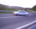 bmw drifting around a highway turn video.