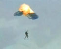 video of a glider fires flare and hits his parachute.