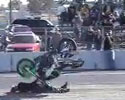 biker tries to do wheelie but ends under his bike.
