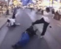 two black guys attack one guy. Street fight.