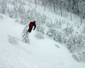 crazy stunt skier jumps into pile of soft snow