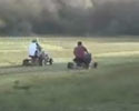 guys race on their tuned lawn mowers. Fun video clip