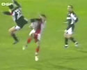 footballer gets kicked in his face by opponent.