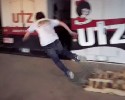 couple of dudes filming their tricks in skate park