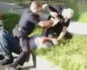 two cops beating some dude in front of cameras