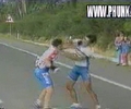 funny windmill fight between two skinny bicyclist.