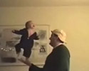 a dad is ballancing his child on his hand